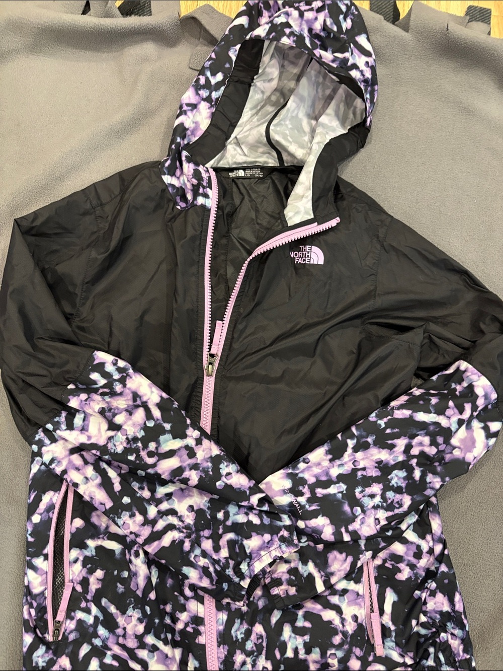 The North Face Black Hooded Windbreaker with Purple Print Accents